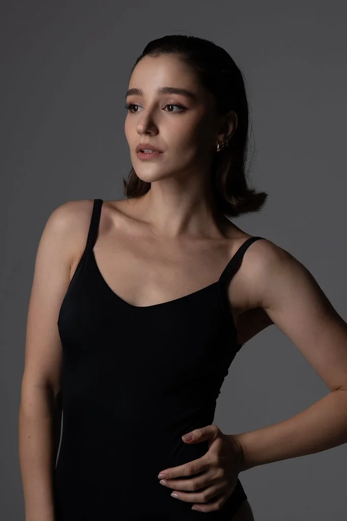 Commercial portrait of Ninia modeling a black bodysuit in a Tbilisi photo studio